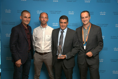 Nourdine Bihmane, COO for Atos Infrastructure Data Management; and Andy Fleck, Head of Multi-Cloud Management for Engage ESM; accepts award from Ken Trombetta, Cisco Vice President, Global and Strategic Partners; and Christophe Labro, Cisco Client Director Atos