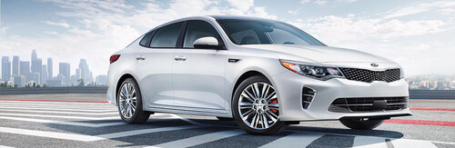 2018 Kia Optima driving on a road.