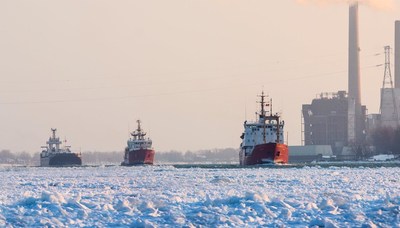 The Canadian Coast Guard Ships Samuel Risley and Griffon escort a commercial ship through heavy ice on the St. Clair River Jan 15 2015. Photo credit: Richard Dompierre. (CNW Group/Fisheries and Oceans Central & Arctic Region)