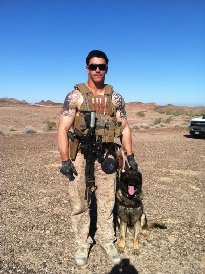 Marine Sgt. Joshua Ashley (22-years-old) stands with his military dog companion, Sirius, named after the brightest star in the constellations. Ashley was slain on a mission in Afghanistan. His dog survived to do one more tour of duty. It was Ashley's wish that his mother, Tammie, received Sirius after his tour of duty ended.