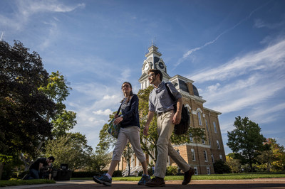 Students walk past Central Hall on the campus of Hillsdale College. The cast-iron bell inside the tower was made for the college from Civil War bullets in 1875.