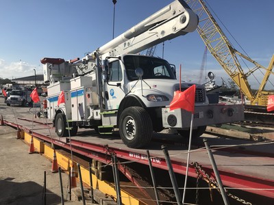 More than 100 Florida Power & Light Company (FPL) trucks and electric equipment are loaded onto barges at the Port of Fort Pierce in Fort Pierce, Fla., Dec. 28, 2017. FPL lineworkers and support staff will meet up with the trucks and equipment in early January and begin working in Puerto Rico with other energy companies to help restore service to residents who remain without power following Hurricane Maria. Photo credit: Christopher McGrath for FPL.