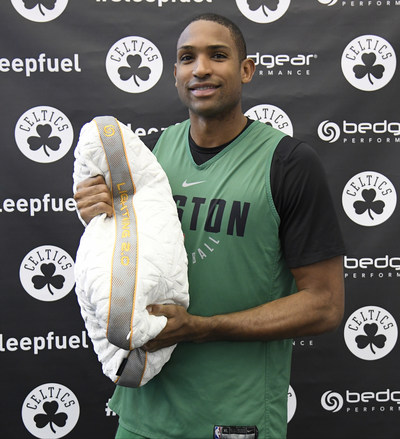 Al Horford holding up his BEDGEAR pillow