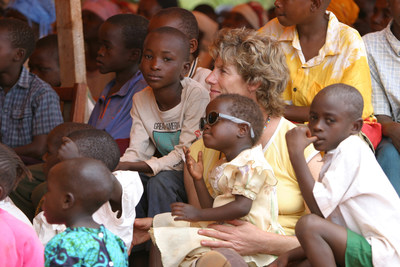 Winnie Barron, 2017 World of Children Humanitarian Award Honoree, sits with orphans in Makindu, Kenya, who she has dedicated much of her life to serving. (PRNewsfoto/World of Children)