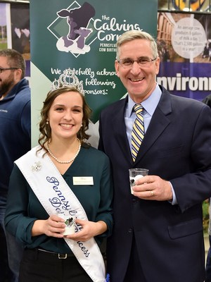 Pennsylvania State Dairy Princess Yvonne Longenecker of Blair County and Pennsylvania Secretary of Agriculture Russell Redding kick off the 2018 Fill a Glass with Hope® fresh milk distribution program with a milk toast at the PA Farm Show.
