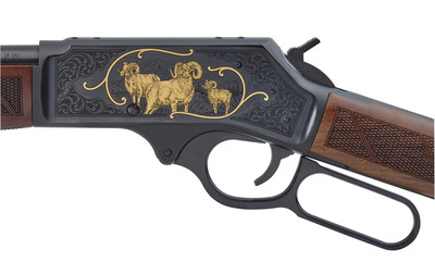 On the left side of the receiver, again border scroll engraving frames three raised-relief gold Bighorn Sheep, set inside gold scrolling, and against a background of the lofty mountain peaks where they thrive.