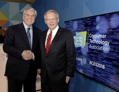 At CES 2018, National Association of Broadcasters President and CEO, Gordon Smith (left), congratulates LG Electronics USA Senior Vice President, John Taylor, for the company's pioneering work behind the ATSC 3.0 Net Gen TV standard.