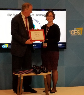 Caitlin Sanchez, VIZIO Counsel receives the EPA's Sustainable Materials Management Electronics Award from Barnes Johnson, EPA Director of the Office of Resource Conservation and Recovery.