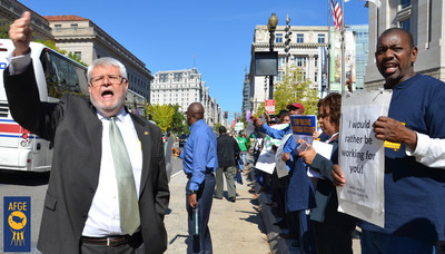 J. David Cox Sr., national president of the American Federation of Government Employees, protests with union activists outside the EPA headquarters in Washington during the 2013 government shutdown. AFGE is urging lawmakers to avoid another disruptive shutdown by passing a budget to keep the government open past Jan. 19.