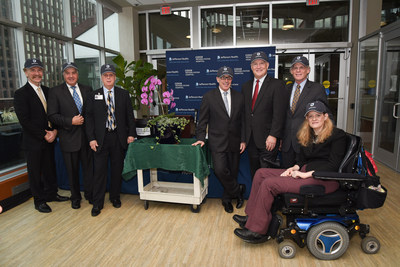 Jefferson Health and Magee Rehabilitation Hospital Leadership, along with patient Katie Samson, celebrate the joint venture of the two organizations by planting an orchid, the flower with the meaning of friendship.