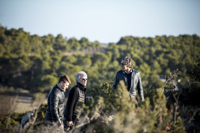 Jesse Bongiovi (left), Jon Bon Jovi (center), and Gérard Bertrand (right) climbing the hill at wine estate, Château l'Hospitalet, in southern France. Photo credit: David Fritz Goeppinger