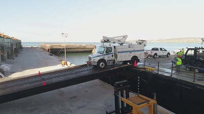 A PPL bucket truck is unloaded at the port of Ponce, Puerto Rico.