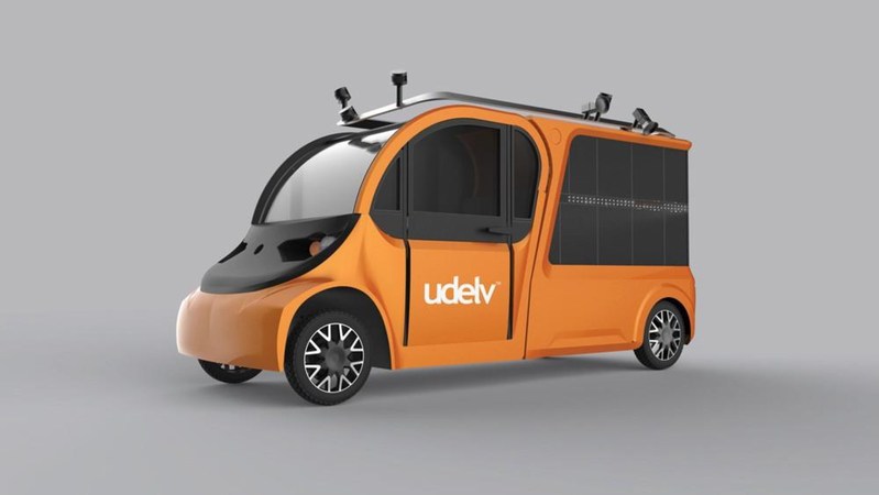 The distinctive orange udelv customized vehicle is built on a fully electric powertrain and features 18 secure cargo compartments with automatic doors using a cloud-based proprietary technology that is shared between the vehicle, customers and merchants.  The vehicle can drive for up to 60 miles per cycle and can load up to 700 pounds of cargo.