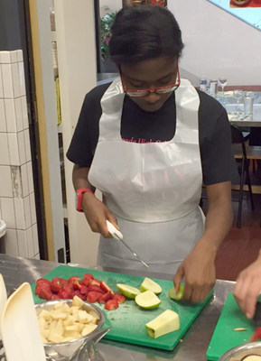 Warrior preps healthy meal ingredients during recent WWP cooking class.