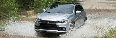 Front exterior view of a 2017 Mitsubishi Outlander Sport driving through a ravine.