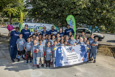 Students from Elizabeth Baldwin Elementary School pictured with New England Patriots Alumni