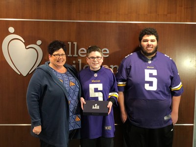 Penny Robinson, Gage and a Guest Pose With Winning Tickets To The Big Game