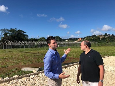 John McMullen, LGC Capital's CEO, with Paul Glavine, Global Canna Labs CEO, inspecting the installation of the Canadian sourced greenhouse frames at Montego Bay in Jamaica. (CNW Group/LGC Capital Ltd)