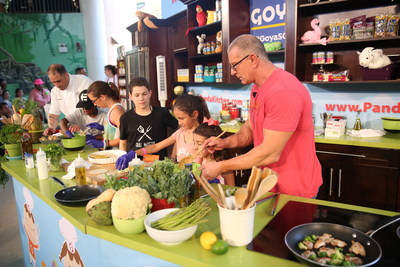 Robert Irvine cooks with attendees at Badia Spices' Fun and Fit as a Family featuring Goya Foods Kidz Kitchen during the 2017 Food Network & Cooking Channel South Beach Wine & Food Festival in Miami, Florida.