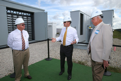 DeSoto County Commission Chairman Jim Selph (left), Florida Power & Light Company (FPL) President and CEO Eric Silagy and DeSoto County Commissioner Terry Hill discuss the company's new battery storage technology at the FPL Citrus Solar Energy Center in DeSoto County, Fla., Feb. 9, 2018. During the commissioning of the company's third and newest solar power plant in DeSoto County - FPL Wildflower Solar Energy Center - the company unveiled what is believed to be the country's first-of-its-kind solar-plus-battery storage system that increases the amount of energy a solar plant delivers to the grid. Photo credit: Alex Menendez for FPL.