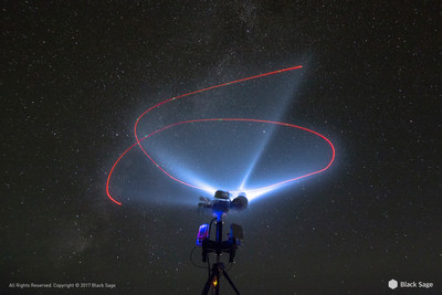 Time exposure photograph of Black Sage's UASX system performing nighttime UAS tracking with directional energy on target.