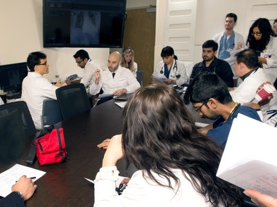 James Gasperino, MD, Chair of Medicine, Associate Chief Medical Officer, and Vice President for Critical Care at The Brooklyn Hospital Center, far left, conducts Morning Report on the ICU with his multidisciplinary team. Credit: Paul O. Colliton