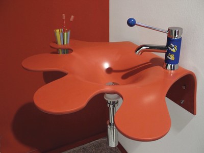The versatility of solid surface in Corian's Hot color.  Photo courtesy of DuPont Corian.
