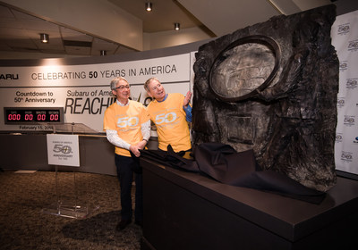 Tomomi Nakamura, Chairman and CEO, and Thomas J. Doll, President and Chief Operating Officer, take a closer look at the 3-by-4-foot, 300-pound bronze plaque commemorating Subaru of America’s 50th Anniversary.