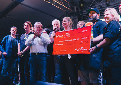 Chef Jose Ramos accepts Red Robin's Best of the Bash Award and oversized check from Amanda Freitag and representatives from Red Robin at the Heineken Light Burger Bash presented by Schweitzer and Sons hosted by Guy Fieri on February 23 in Miami. Photo by Carl-Frederick Francois/FIU