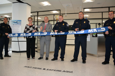 Miami-Dade County Commissioner Rebeca Sosa, Miami-Dade Aviation Director Lester Sola, CBP Executive Assistant Commissioner Todd Owen, and CBP Miami Port Director Christopher Maston cut the ceremonial ribbon for the new Concourse E passport screening facility at MIA.