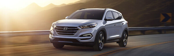 Driver side exterior view of a gray 2018 Hyundai Tucson.