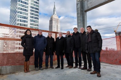 (Left to right) Lightstone’s Lucy Pires, William Hunsberger, Mark Green, President Mitchell Hochberg, Christopher Baxter and David Duvoisin, and Stonehill + Taylor’s Neill Parker and Peter Nicolosi, celebrate the topping out of Moxy Chelsea.