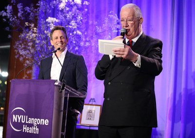 C. Hugh Hildesley and Seth Meyers during the live auction at the 2018 FACES Gala.