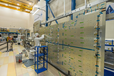 Lockheed Martin technicians begin assembly on the JCSAT-17 commercial communications satellite in a clean room near Denver.