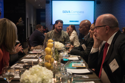 Café Momentum founder Chad Houser with BBVA Compass guests Thursday night at his restaurant in Dallas, where the bank gathered to celebrate his first-place prize of $50,000 in the BBVA Momentum training and accelerator program for social entrepreneurs.