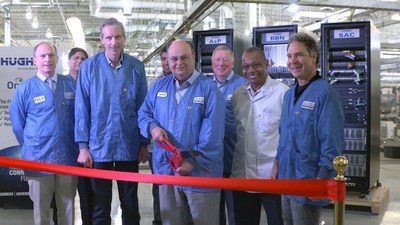 Greg Wyler visits Hughes executives at Hughes manufacturing facility in Gaithersburg, MD for first gateway shipment.