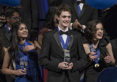 Washington, D.C., March 13, 2018?Benjy Firester (center), 18, of New York City, won first place and $250,000 in Regeneron Science Talent Search 2018, founded and produced by Society for Science & the Public. Isani Singh (left), 18, of Aurora, Colorado, was awarded third place and $150,000, and Natalia Orlovsky (right), 18, of Chadds Ford, Pennsylvania, was awarded second place and $175,000. Photo Credit: Chris Ayers/Society for Science & the Public (PRNewsfoto/Society for Science & the Public)