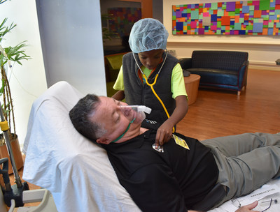 Dr. Mark Mogul, medical director of pediatric hematology/oncology at St. Joseph's Children's Hospital in Tampa, gets a checkup from 11-year-old D'lany Harrigan during the hospital's annual 
