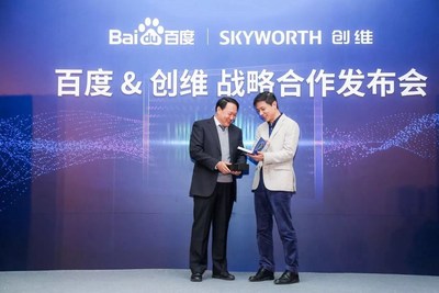 Baidu's Founder, Chairman and CEO Robin Li and Skyworth Group's Chairman of the board Lai Weide exchange gifts