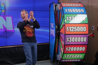 Christopher Ouellette of Harrow celebrates after spinning THE BIG SPIN Wheel at the OLG Prize Centre in Toronto to win $300,000. Ouellette won a top prize with OLG’s INSTANT game – THE BIG SPIN. (CNW Group/OLG Winners)
