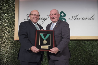 Honorable Sonny Perdue, U.S. Secretary of Agriculture, presents Zippy Duvall, president of the American Farm Bureau Federation, with the Distinguished 4-H Alumni Medallion during the 9th annual National 4-H Council Legacy Awards on Tuesday, March 20, 2018, in Washington. (AP Images for National 4-H Council)