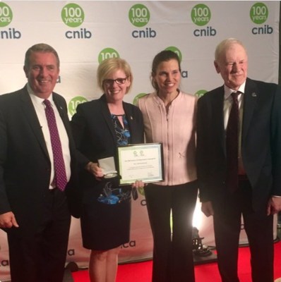 The Honourable Carla Qualtrough receives her CNIB Century of Change Award during last night's event from CNIB President and CEO John M. Rafferty, CNIB National Board Chair Ronald J. Kruzeniski and the Honourable Kirsty Duncan. (CNW Group/CNIB)