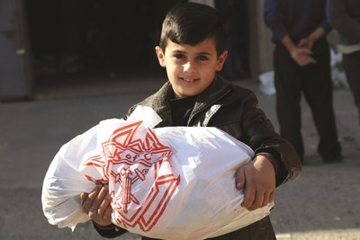 An Iraqi boy is glad to receive food stuffs provided by the Knights of Columbus. The Catholic fraternal organization has raised and committed almost $19 million in aid to Christians and other persecuted religious minorities in the Middle East.