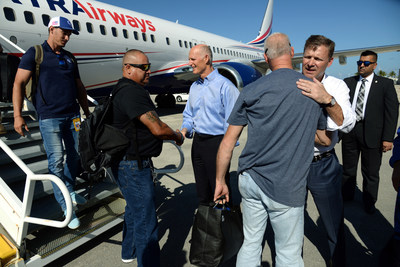 Florida Gov. Rick Scott (left) and Florida Power & Light Company (FPL) President and CEO Eric Silagy welcome FPL personnel returning from restoring power in Puerto Rico at Palm Beach International Airport in West Palm Beach, Fla., April 3, 2018. More than 120 FPL lineworkers, management and support staff returned to Florida following a three-month mutual assistance deployment to Puerto Rico in the aftermath of Hurricanes Maria and Irma. Photo credit: Scott Fisher for FPL.