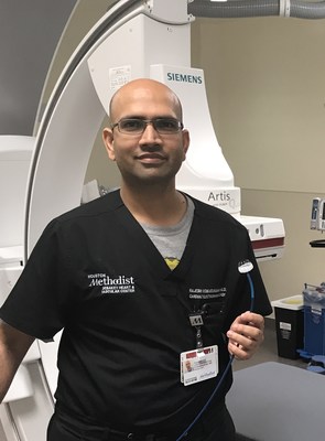 Dr. Rajesh Venkataraman holding a WATCHMAN LAAC Implant at Houston Methodist The Woodlands Hospital