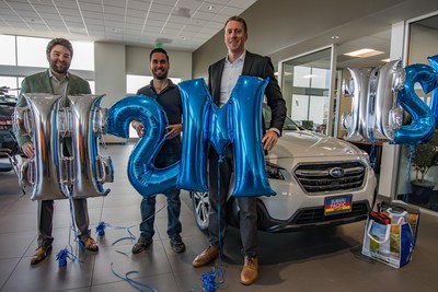 Subaru sells two-millionth Outback in the U.S. (L to R) Sean Sullivan (president, Subaru Pacific) Andrew Simpson (Outback owner), and Tim Tagye (Subaru of America)