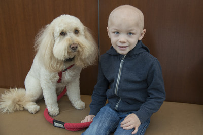 Hudson Brown and his therapy dog, Maddie, at Beaumont Hospital, Royal Oak's Proton Therapy Center in Michigan.