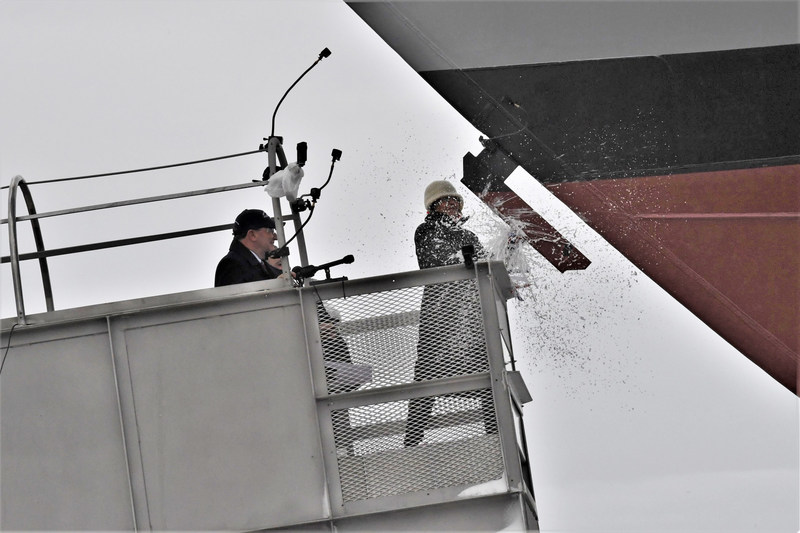 Ship sponsor Jill Donnelly breaks a bottle of champagne across the bow during the christening ceremony for the nation’s 17th Littoral Combat Ship, the future USS INDIANAPOLIS, at the Fincantieri Marinette Marine shipyard on April 14.