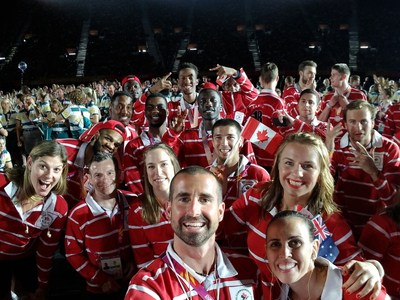 Chef Claire Carver-Dias and Assistant Chef Benoit Huot, along with Canadian Team Flag Bearer Erica Wiebe take a selfie during the 2018 Gold Coast Commonwealth Games Closing Ceremony. (CNW Group/Commonwealth Games Association of Canada)