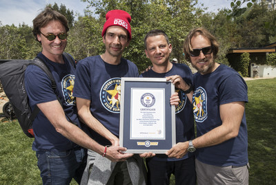 Dominic Cunningham-Reid, Producer; Taran Davies, Producer; George Duffield, Producer; Daniel Ferguson, Writer, Director accept the GUINNESS WORLD RECORD title for “Largest dog photo shoot.